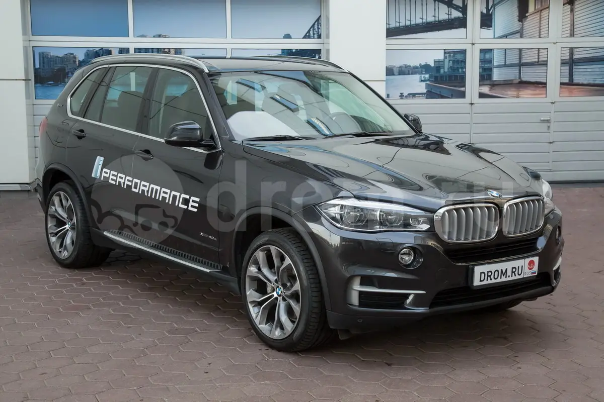 bmw x5 или киа спортадже